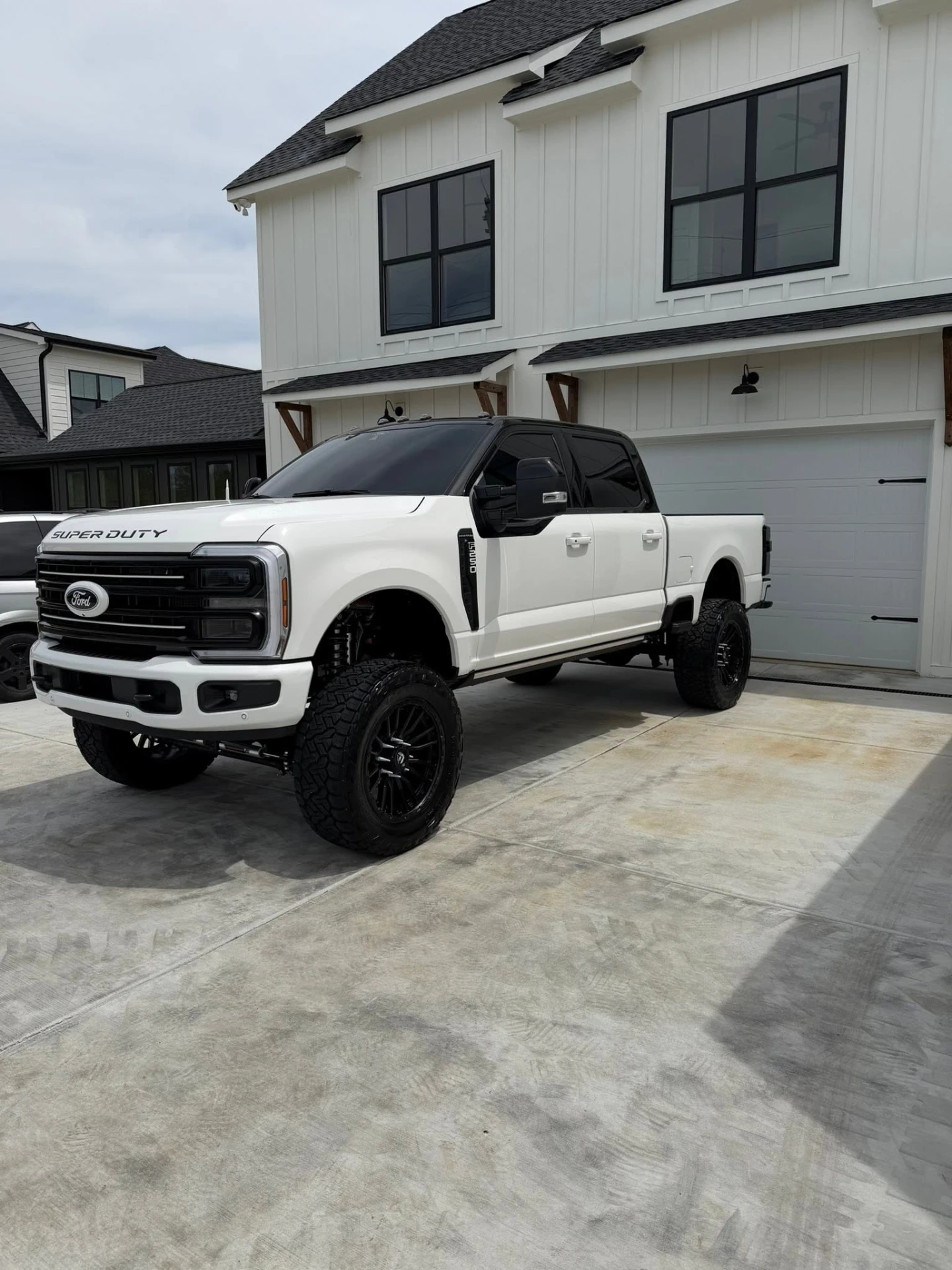 Lifted white Ford F-250 Super Duty after full exterior detail
