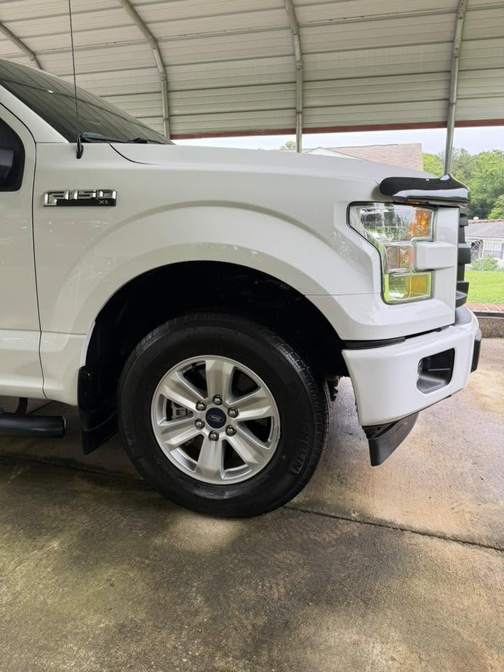 Ford F-150 side profile with clean wheels and tires