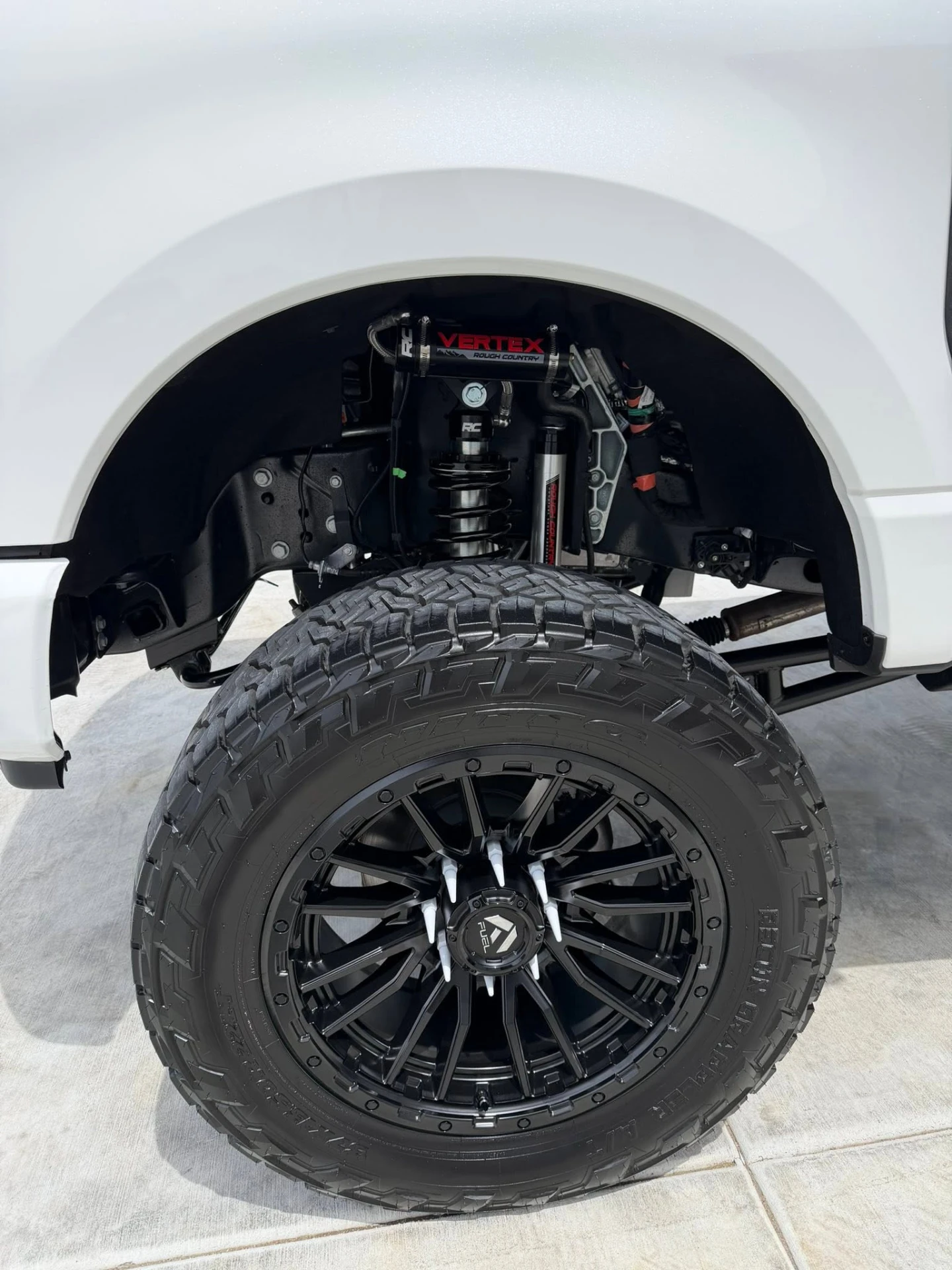 Close-up of Ford F-250 wheel well and Fuel wheel after detail