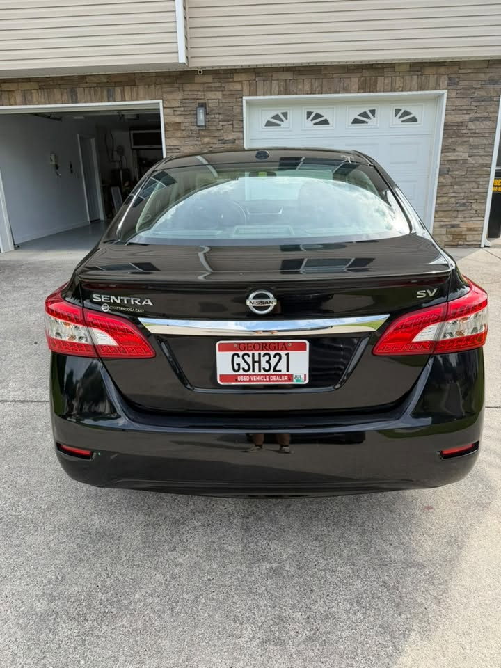 Nissan Sentra rear after detail — mirror shine
